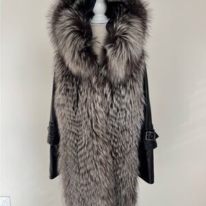 Elegant a real fur jacket . Removable sleeve and hood.